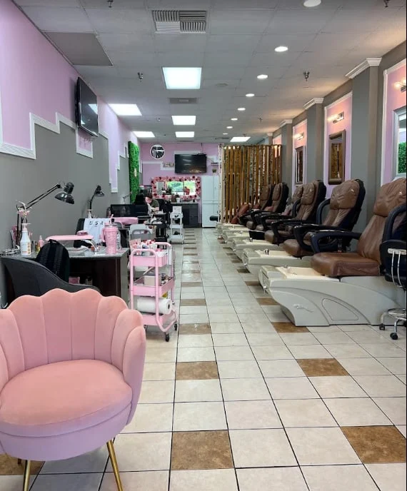 Pink velvet pedicure chairs at Luxe Nails