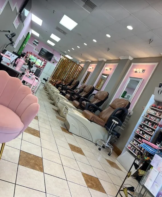 Pedicure chairs and polish wall at Luxe Nails